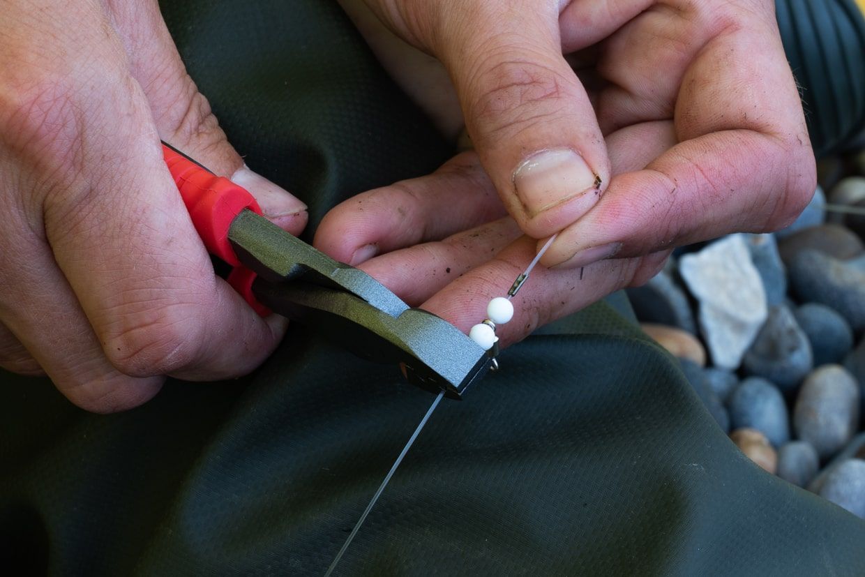 Crimping a swivel on line with pliers