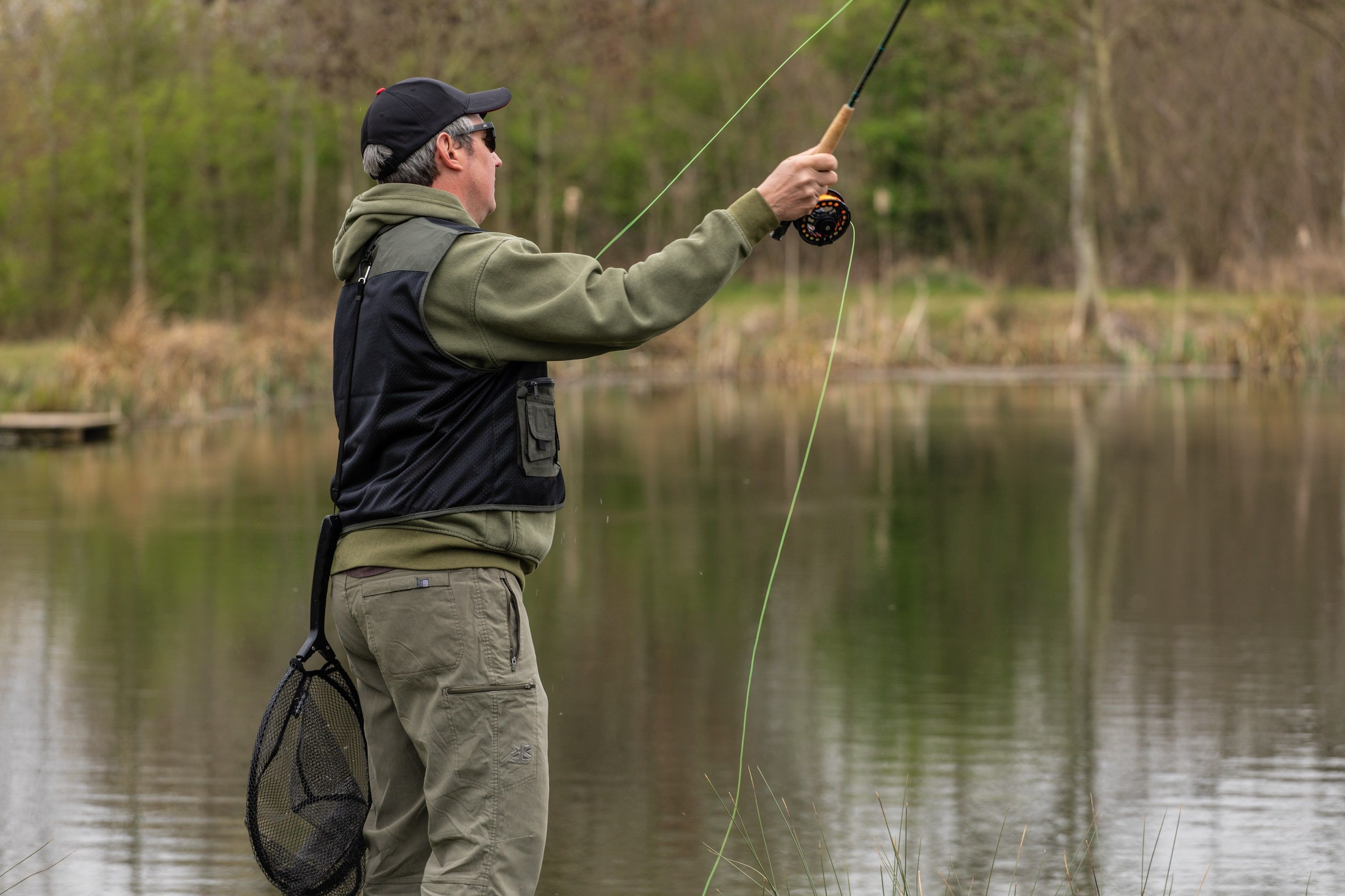 Angler Casting Fly Fishing Rod and Fly Line