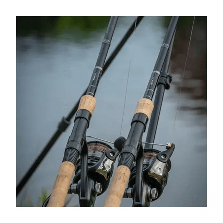 Korum Barbel Fishing Rods by the water
