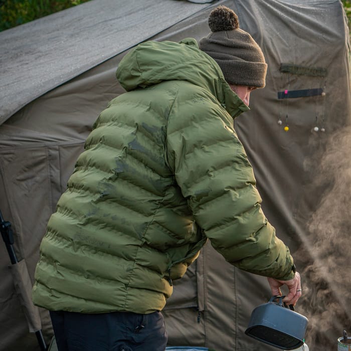 RidgeMonkey APEarel Dropback K2 Waterproof Coat Green In Use 7