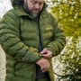 RidgeMonkey APEarel Dropback K2 Waterproof Coat Green In Use 1