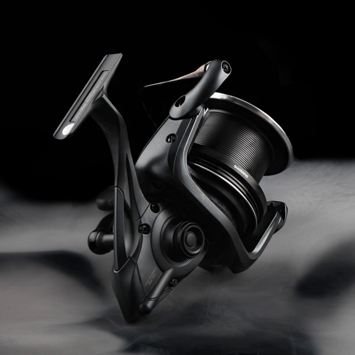 Shimano Aero Technium Magnesium XTC Reel Close Up On Wood On Black