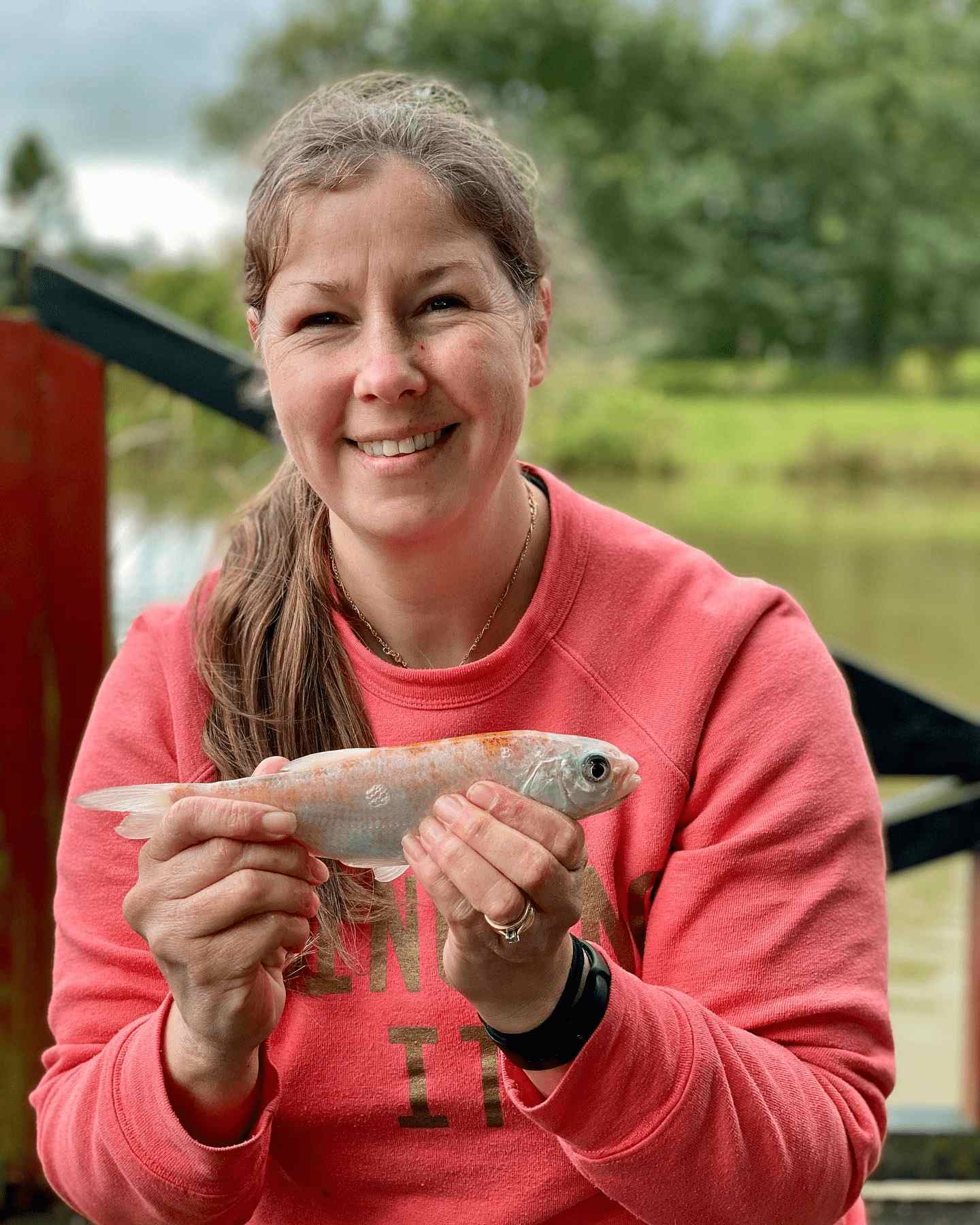 Facebook image of Mum with Orfe fish